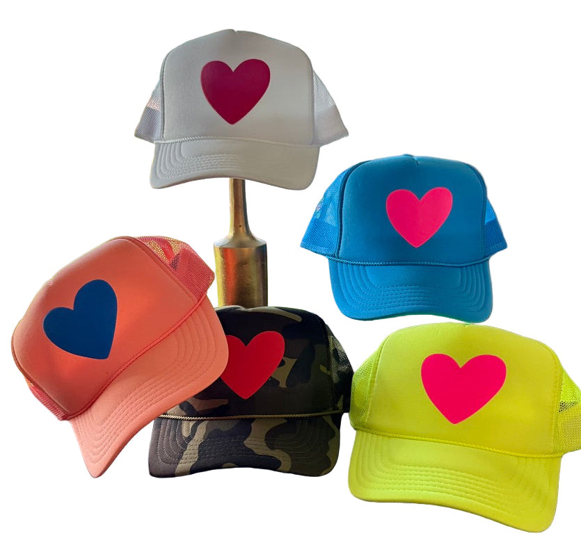Five colorful caps with heart designs on a white background