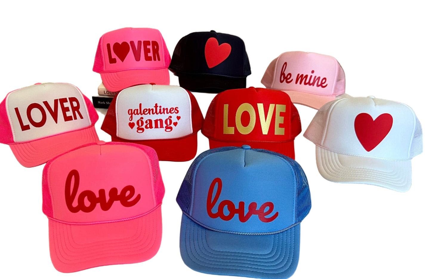 Collection of Valentine's Day-themed hats with various designs on a white background