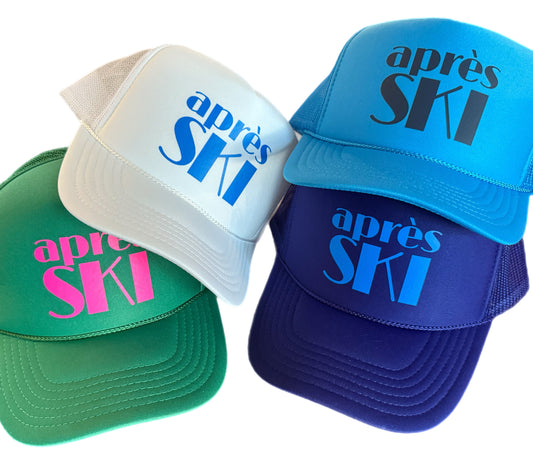 Four colorful caps with 'apres SKI' text on a white background