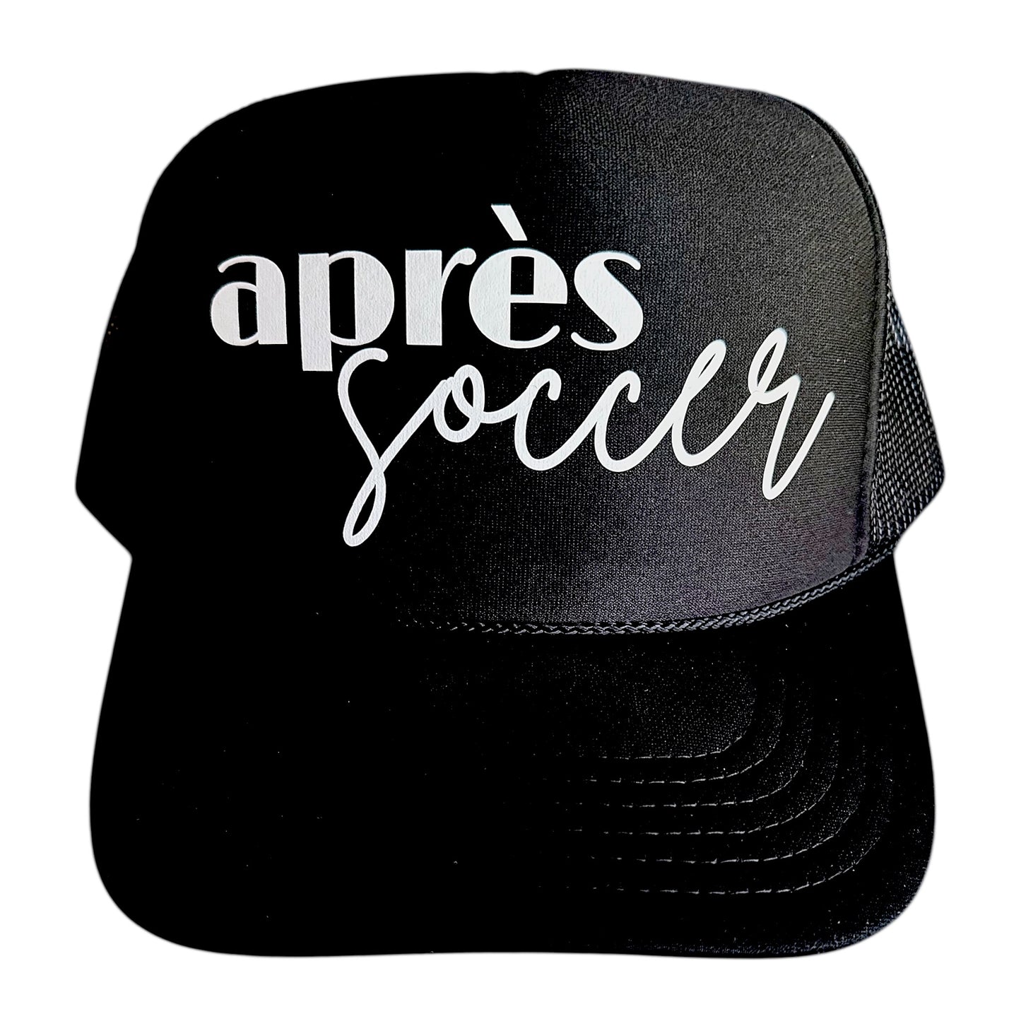 Black foam, snapback trucker hat with Apres Soccer in lowercase font with script by stevi.