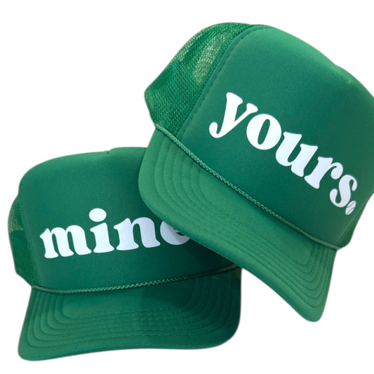 Green “mine” and “yours” tennis trucker hats, matching green foam mesh snapback caps with white script lettering