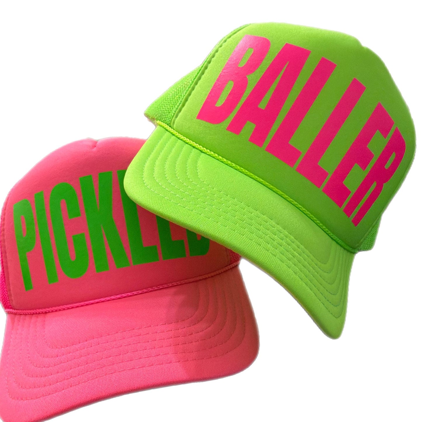 Two neon trucker hats with large logo with one logo PICKLED and one BALLER by stevi