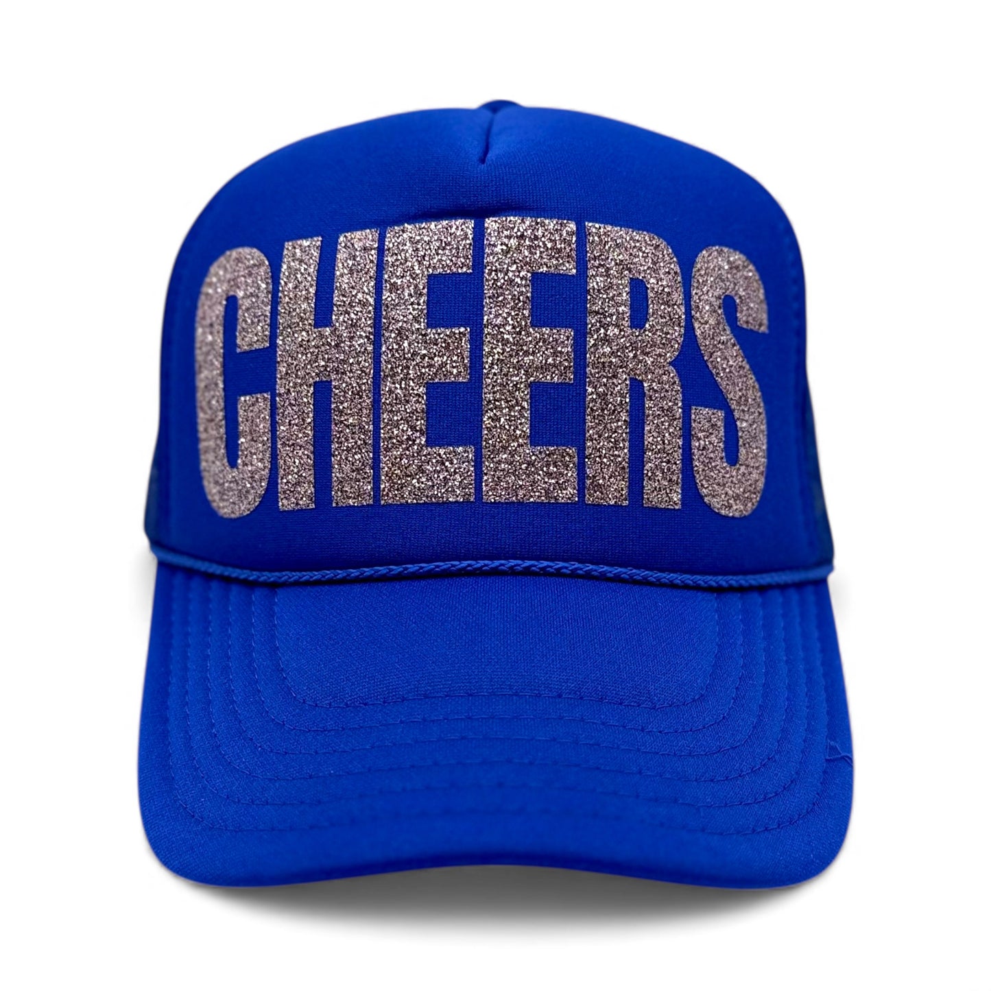 Royal blue foam trucker hat with large silver glitter “CHEERS” text on the front, festive party snapback.
