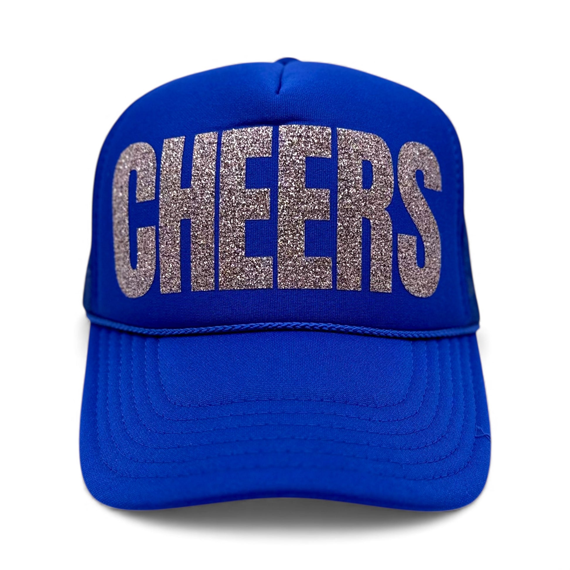 Royal blue foam trucker hat with large silver glitter “CHEERS” text on the front, festive party snapback.
