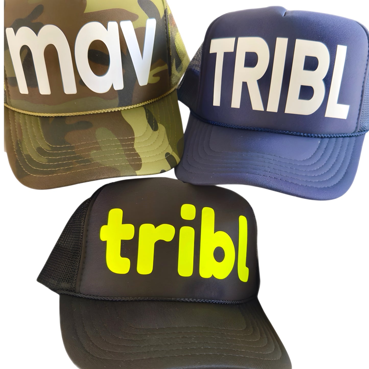 Three caps with 'mav', 'TRIBL', and 'tribl' text on a white background