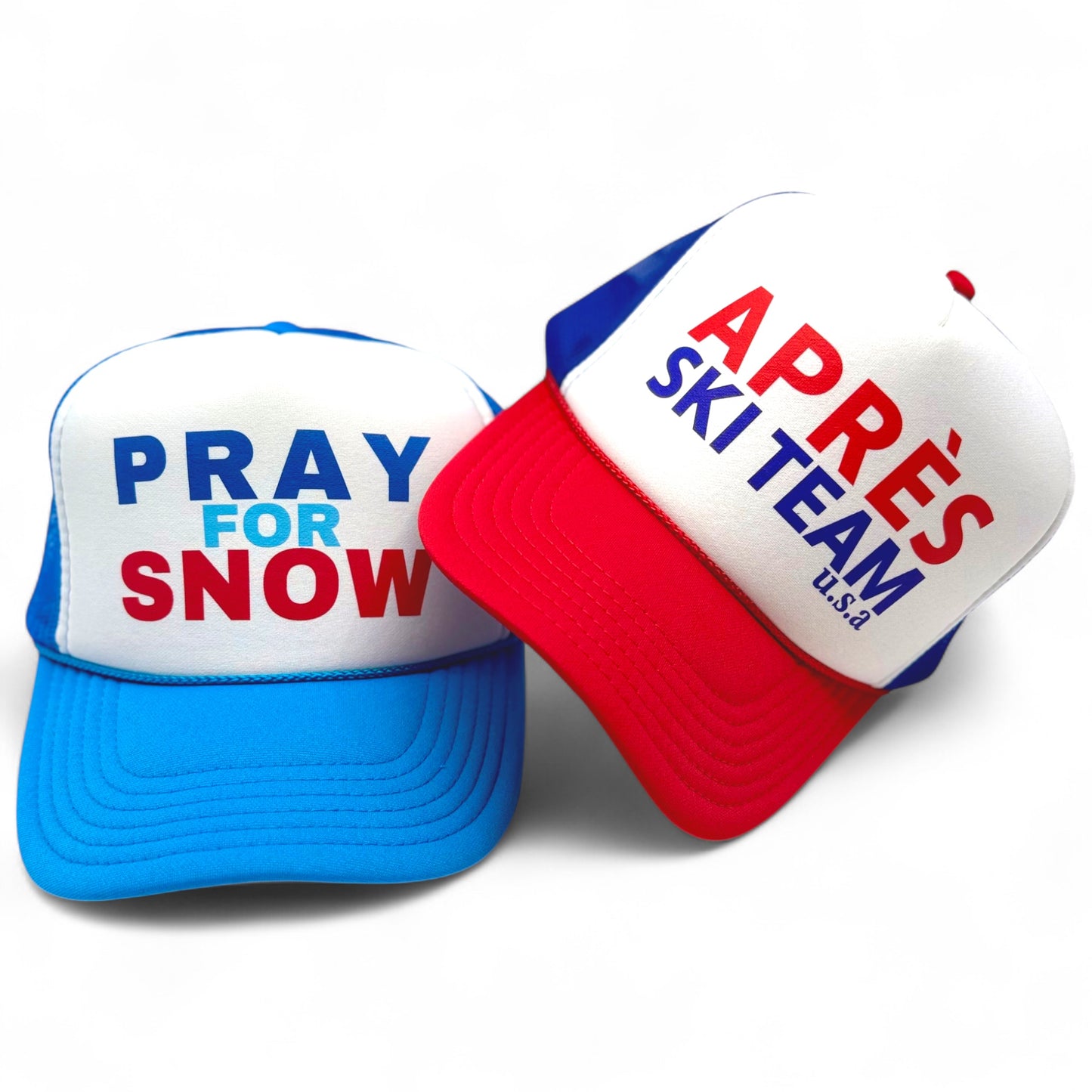 Two hats with text 'Pray for Snow' and 'Apres Ski Team USA' on a white background