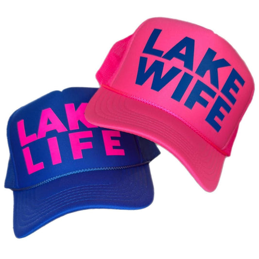 Neon “Lake Life” foam front trucker hat with breathable mesh back and adjustable snapback. Bold royal blue and neon pink design, comfortable for lake days, boat parties, bachelorette trips, and summer group photo ops.